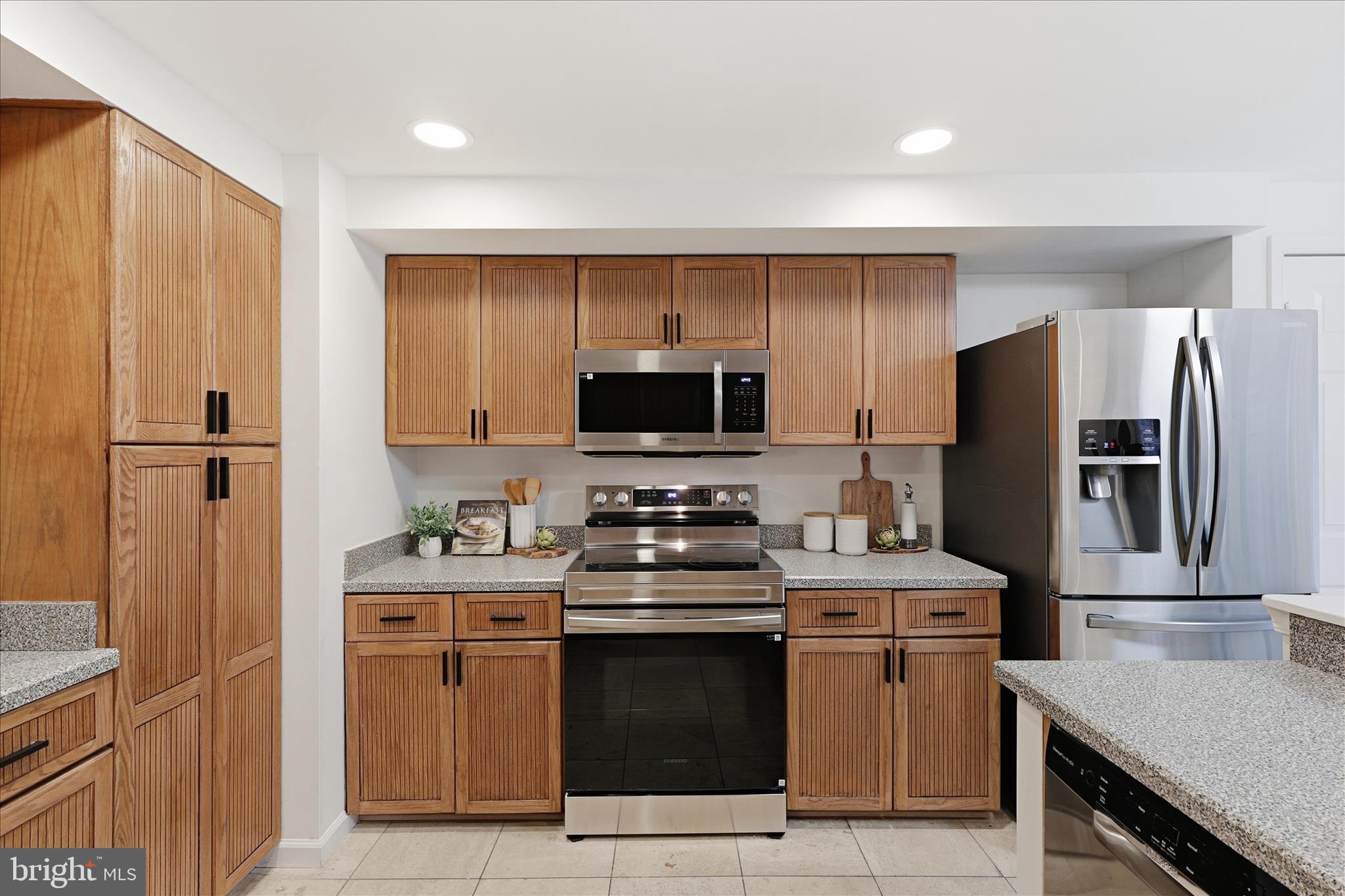 11725 Arbor Glen Way Reston, VA 20194 - Photo 12 of 63 a kitchen with a stove and a refrigerator