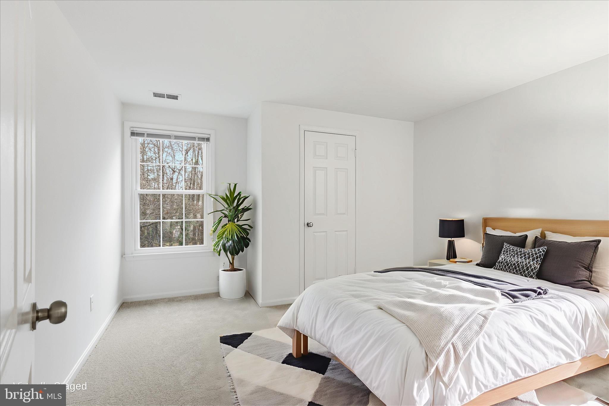 11725 Arbor Glen Way Reston, VA 20194 - Photo 24 of 63 a bedroom with a balcony a bed and a window