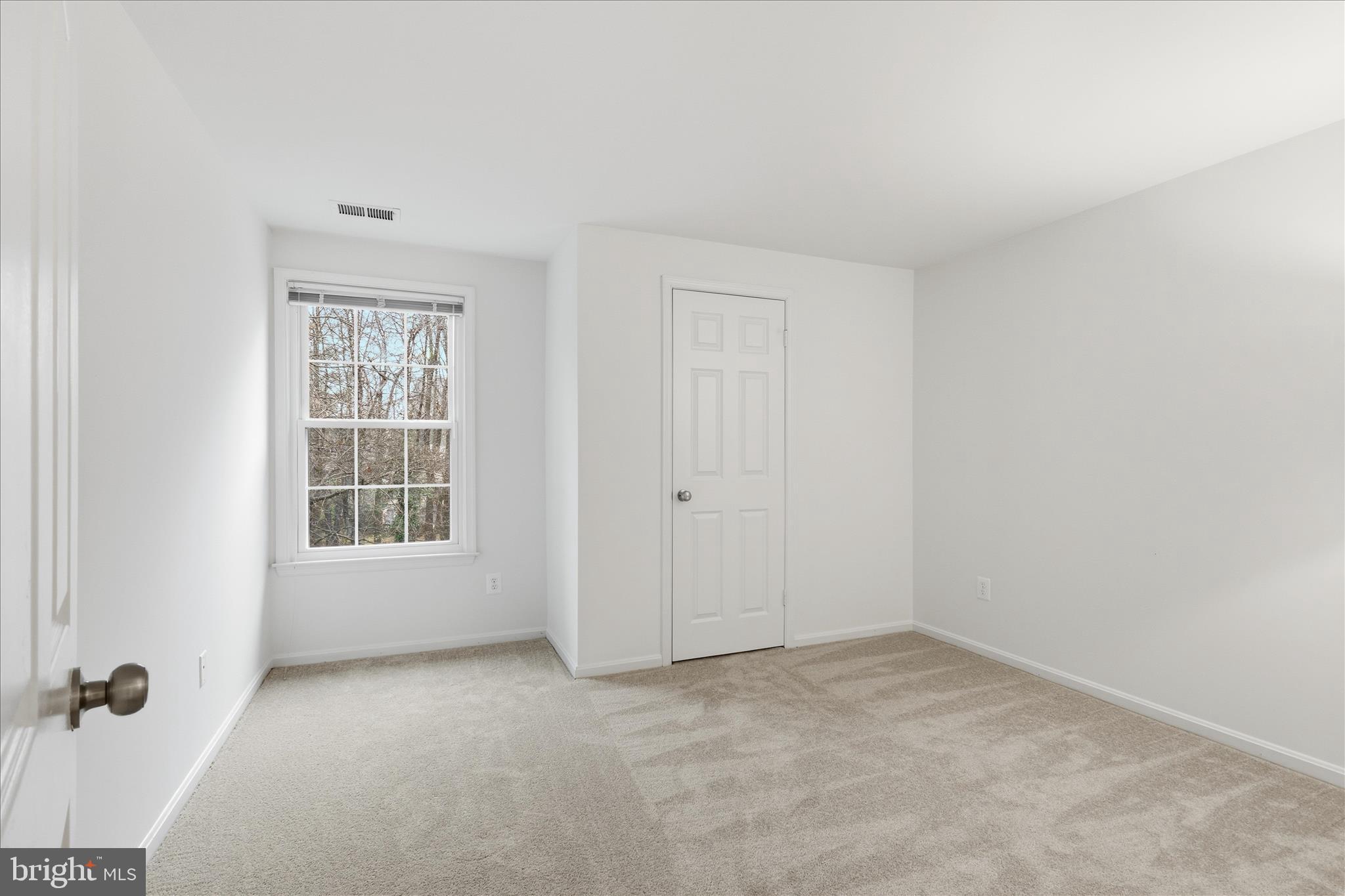 11725 Arbor Glen Way Reston, VA 20194 - Photo 25 of 63 an empty room with a window