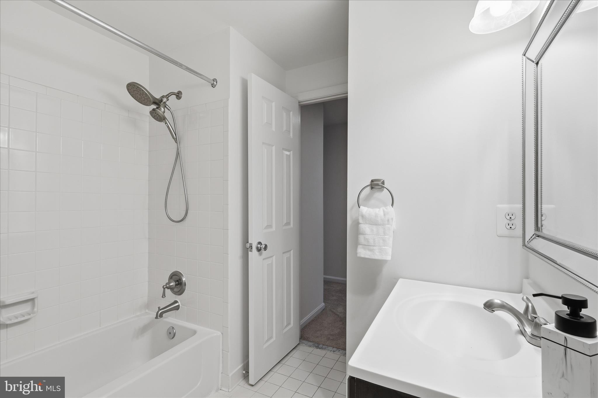 11725 Arbor Glen Way Reston, VA 20194 - Photo 27 of 63 a bathroom with a sink vanity tub and shower