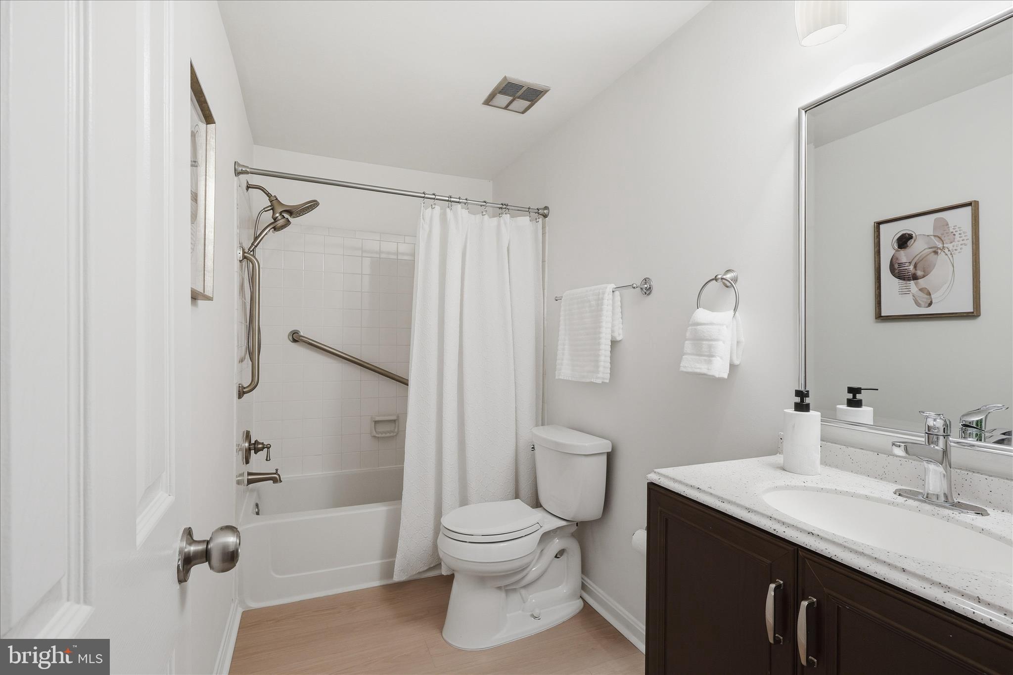 11725 Arbor Glen Way Reston, VA 20194 - Photo 34 of 63 a bathroom with a sink toilet and shower