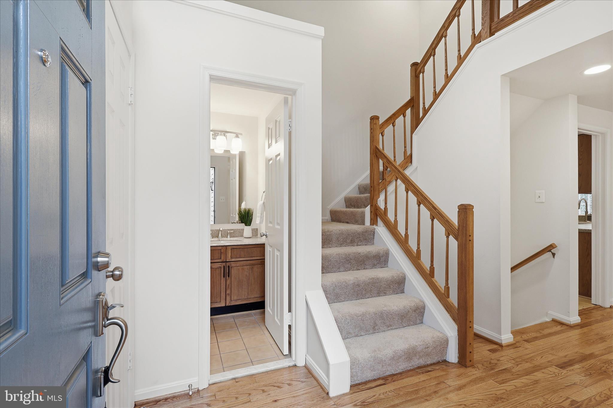 11725 Arbor Glen Way Reston, VA 20194 - Photo 4 of 63 a view of an entryway with wooden floor and staircase