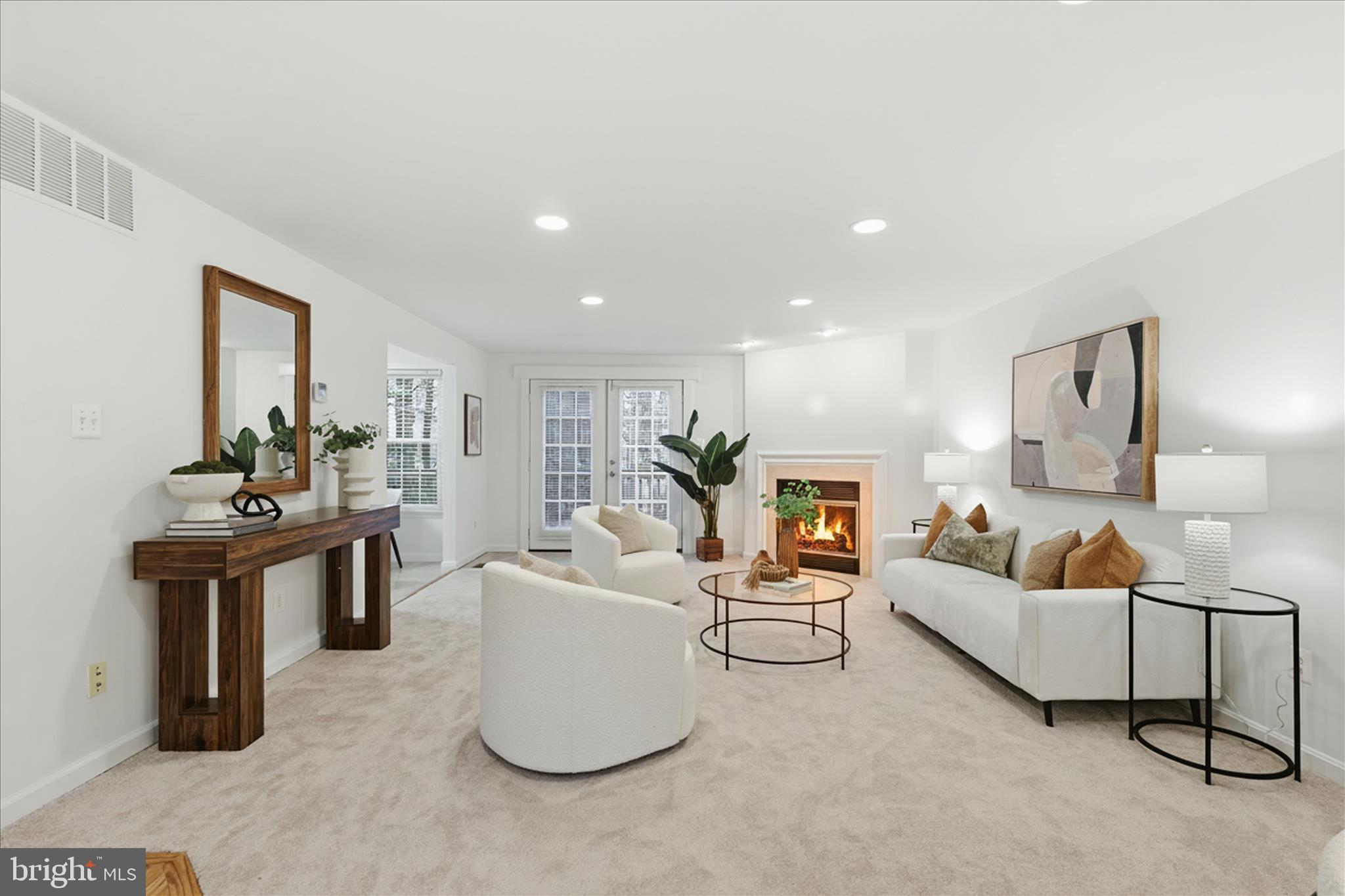 11725 Arbor Glen Way Reston, VA 20194 - Photo 6 of 63 a living room with furniture and a fireplace