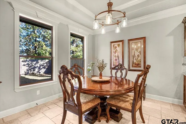 a view of a dining room with furniture window and outside view