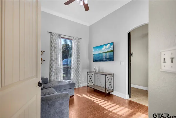 a living room with furniture and a flat screen tv