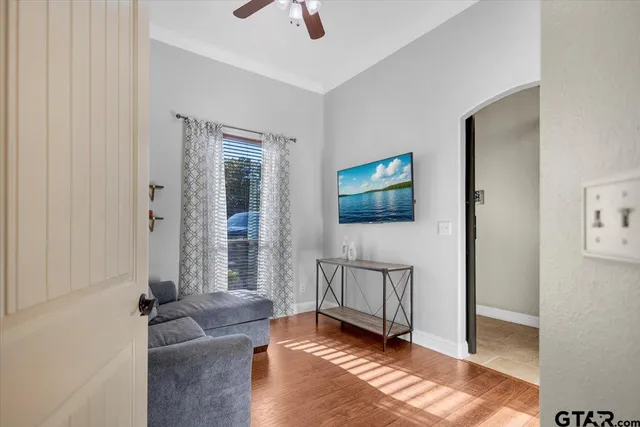a living room with furniture and a flat screen tv