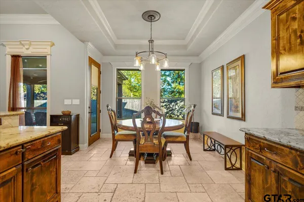 a dining room with furniture and window