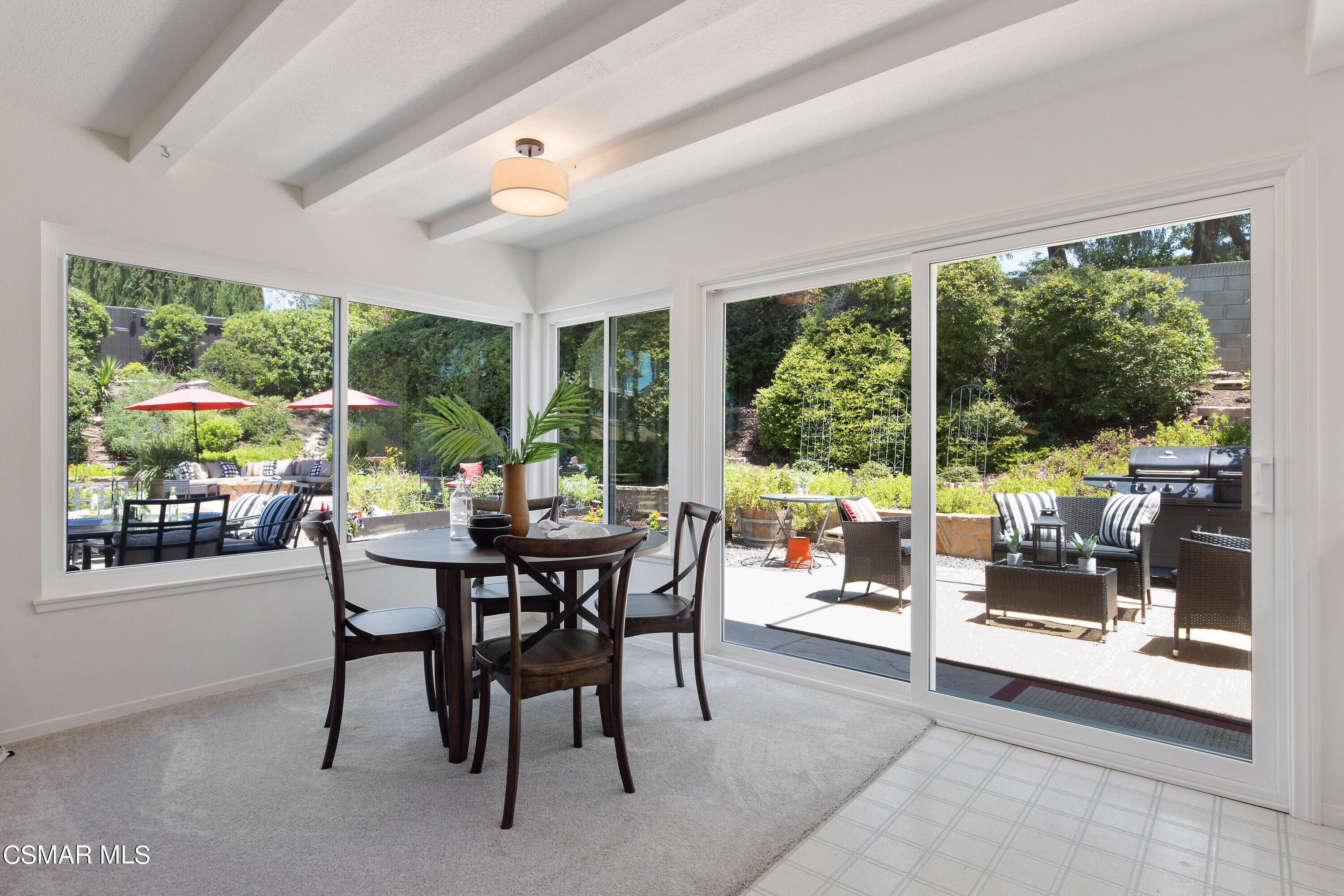 3049 Westridge Circle Thousand Oaks, CA 91360 - Photo 25 of 62 a dining room with furniture water view and a floor to ceiling window
