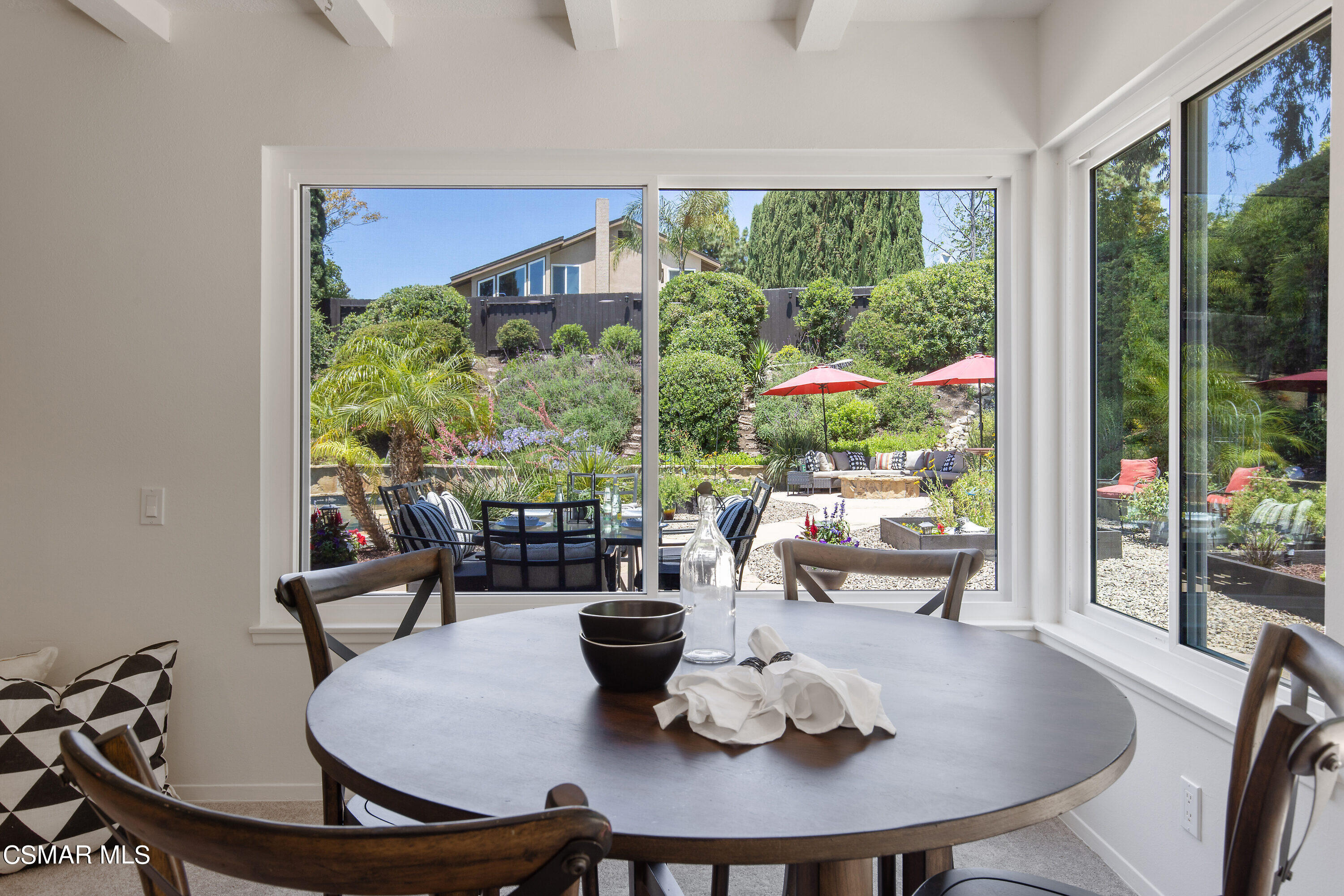 3049 Westridge Circle Thousand Oaks, CA 91360 - Photo 28 of 62 a view of a dining room with furniture large windows and wooden floor