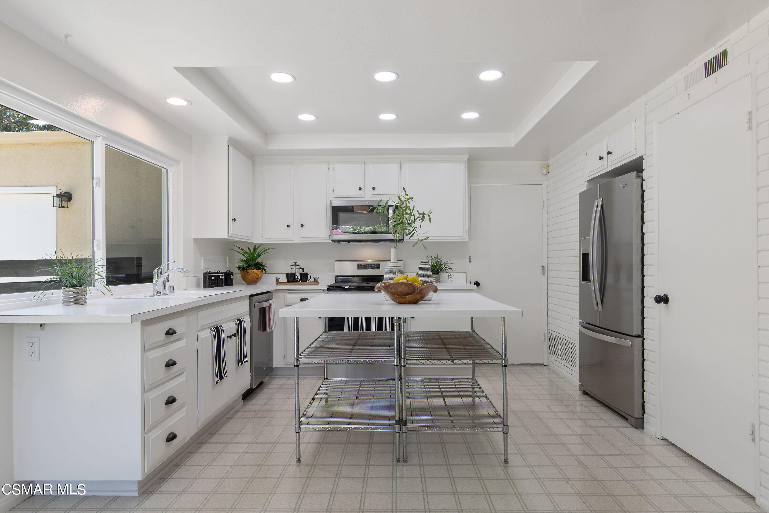 3049 Westridge Circle Thousand Oaks, CA 91360 - Photo 30 of 62 a kitchen with white cabinets and stainless steel appliances