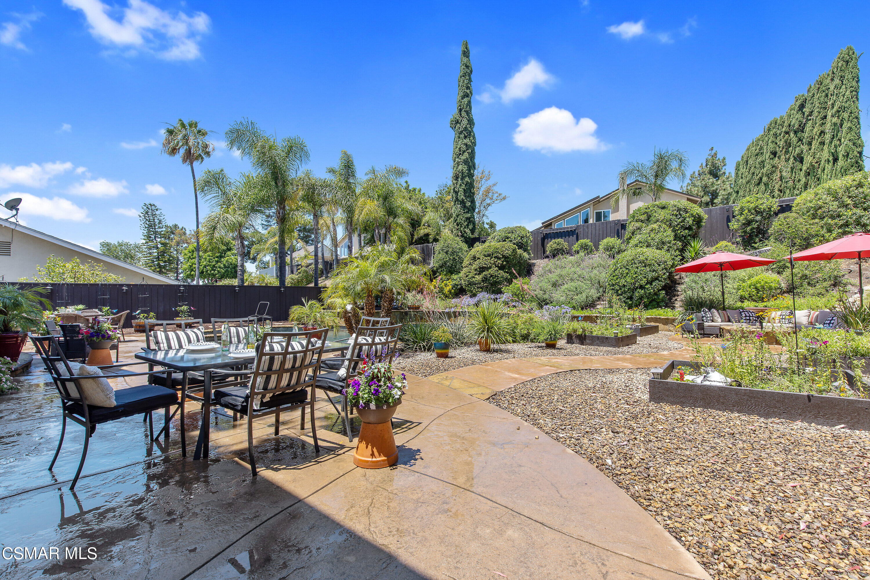3049 Westridge Circle Thousand Oaks, CA 91360 - Photo 46 of 62 a view of a patio with a table and chairs and potted plants
