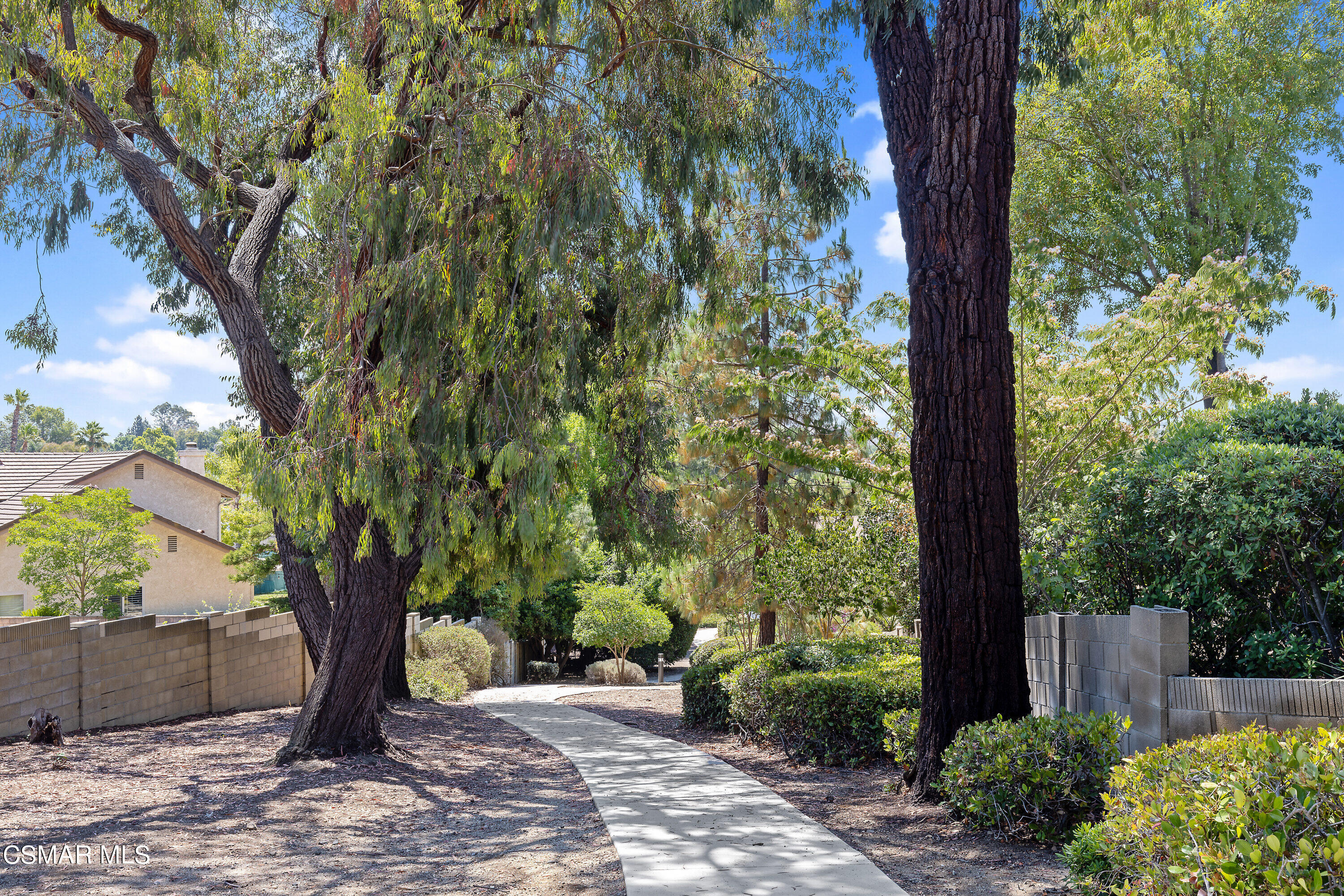 3049 Westridge Circle Thousand Oaks, CA 91360 - Photo 60 of 62 a view of a backyard with plants and large trees