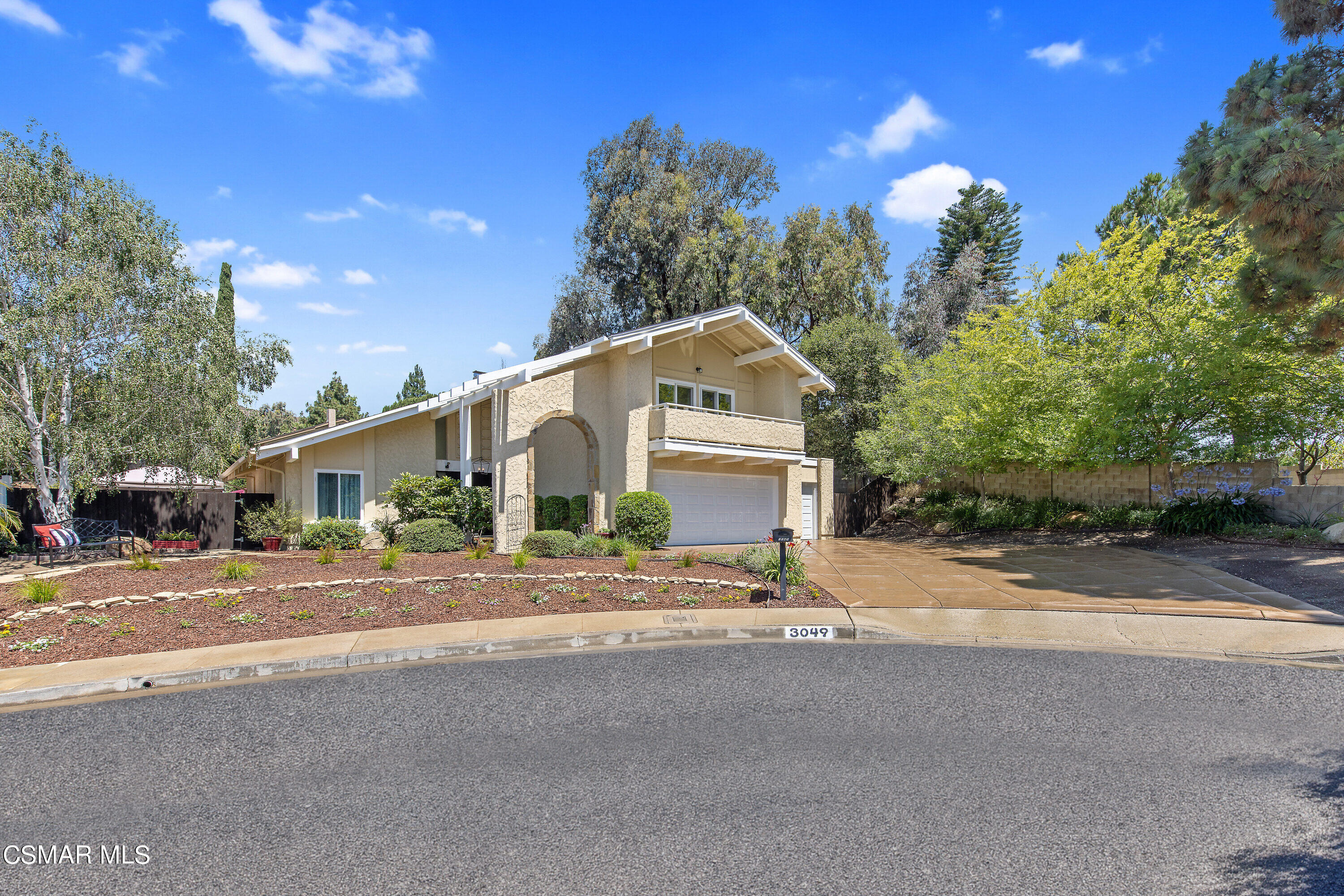 3049 Westridge Circle Thousand Oaks, CA 91360 - Photo 7 of 62 a front view of a house with a yard and a garage