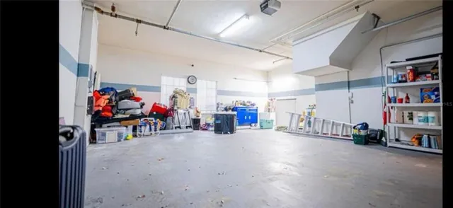a view of staircase with lots of frames and chairs