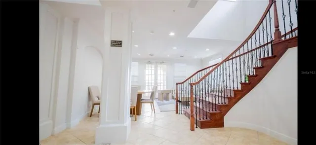 a view of a bedroom with furniture and window