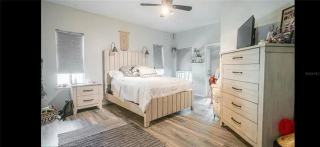 a bedroom with a bed and a dresser