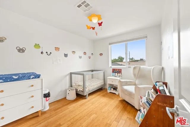 a bedroom with furniture and a chandelier