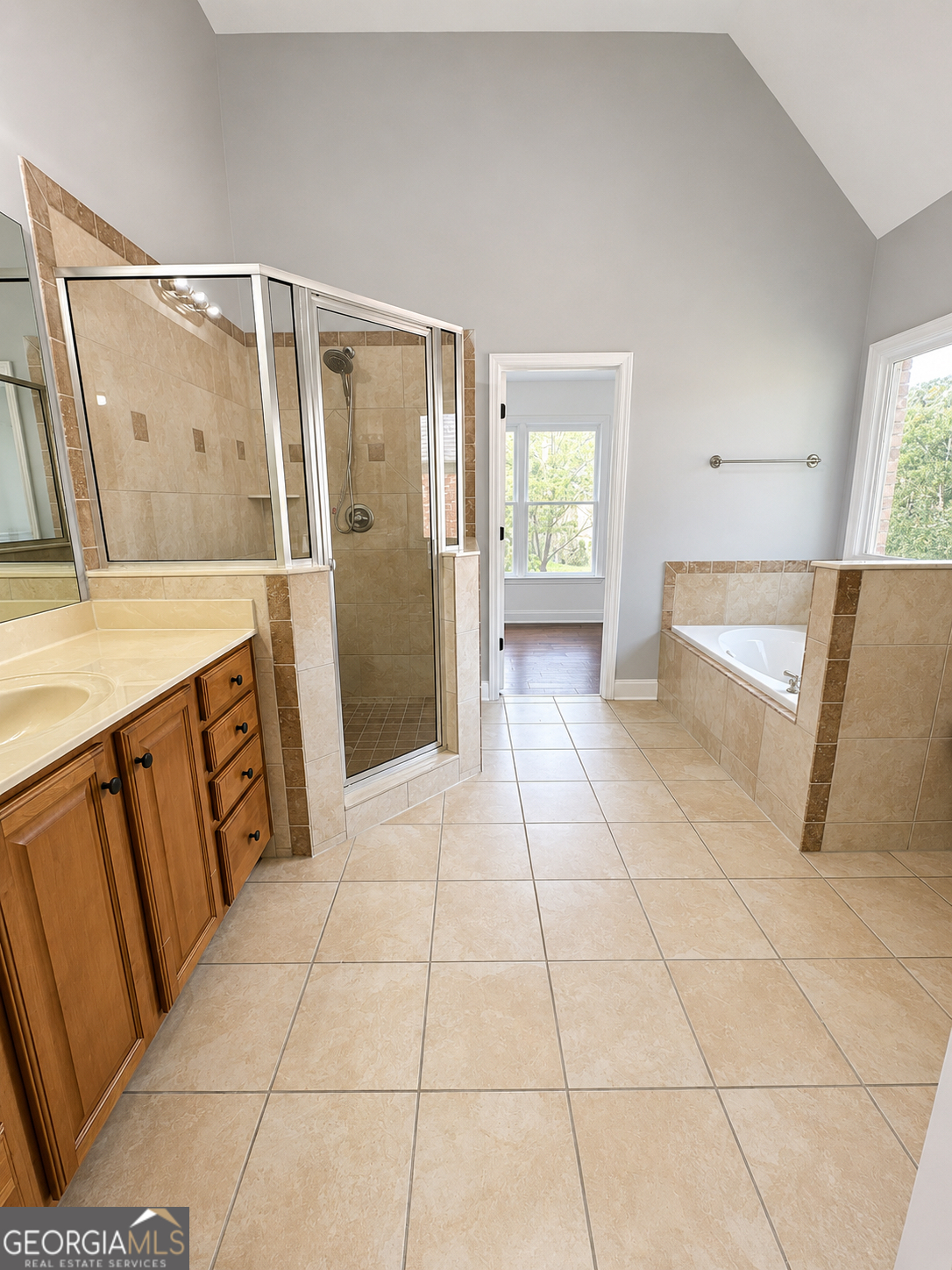 2614 Dolostone Way Dacula, GA 30019 - Photo 21 of 29 a bathroom with a sink a mirror and shower