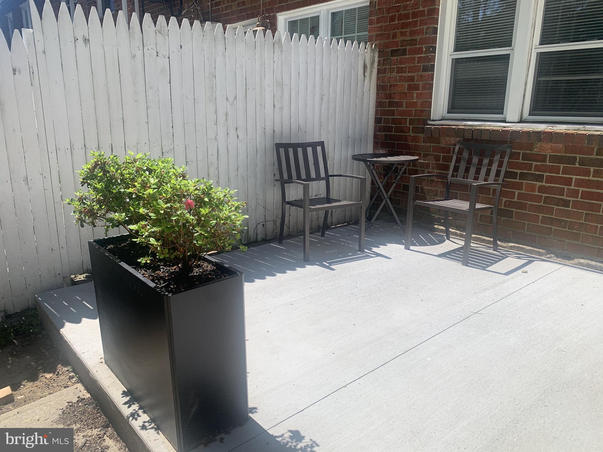 163 Wiltshire Road Claymont, DE 19703 - Photo 31 of 32 New patio with planters and outdoor furniture