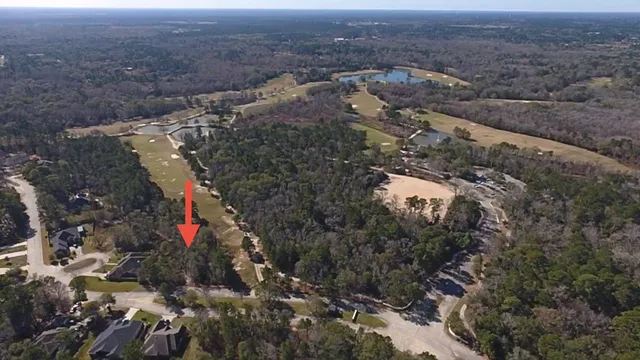 an aerial view of residential house and car parked