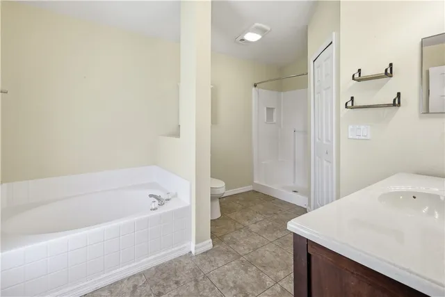 a bathroom with a bathtub and a sink