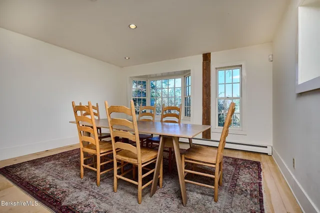 a view of a kitchen with wooden floor