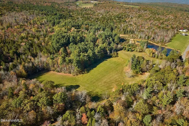 a sign that is sitting on a beach