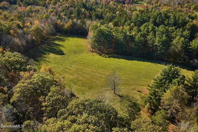 a view of a ocean with a building in the background