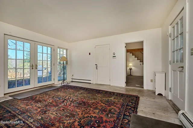 a view of a livingroom with an empty space and a fireplace