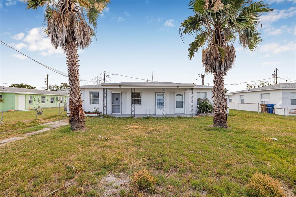 30 Lynn Way Madeira Beach, FL 33708 - Photo 1 of 16 a front view of a house with garden