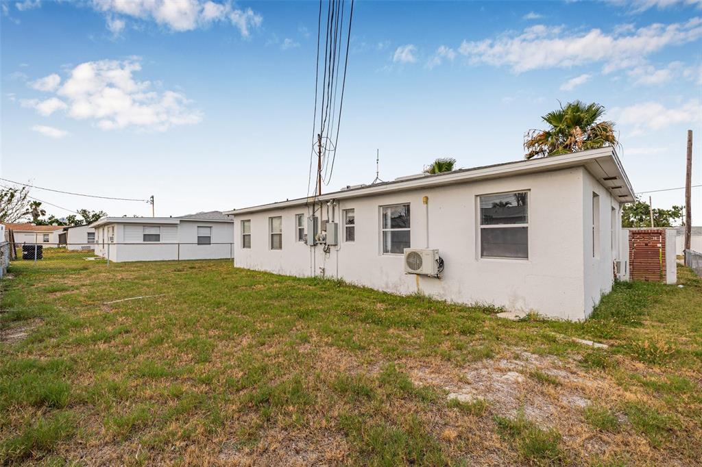 30 Lynn Way Madeira Beach, FL 33708 - Photo 11 of 16 a view of a house with a yard