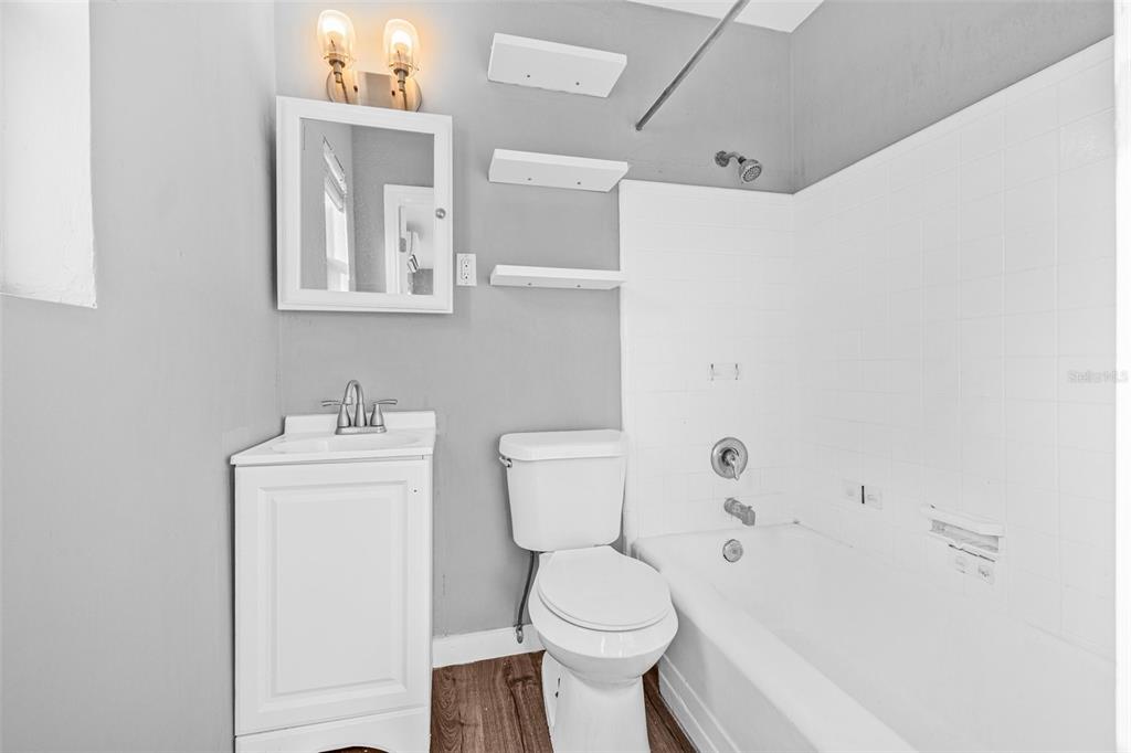 30 Lynn Way Madeira Beach, FL 33708 - Photo 9 of 16 a white toilet sitting next to a bathroom sink