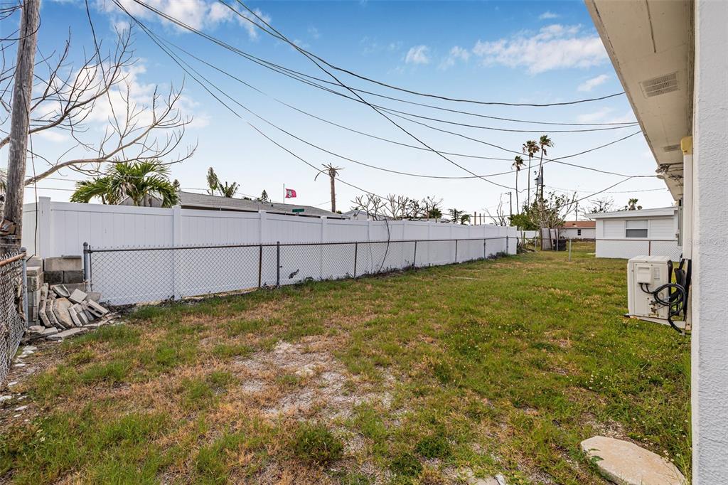 30 Lynn Way Madeira Beach, FL 33708 - Photo 10 of 16 a view of a backyard