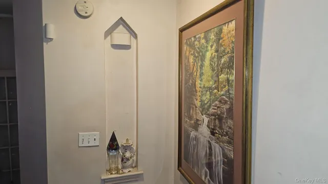 a spacious bedroom with a bed and a window