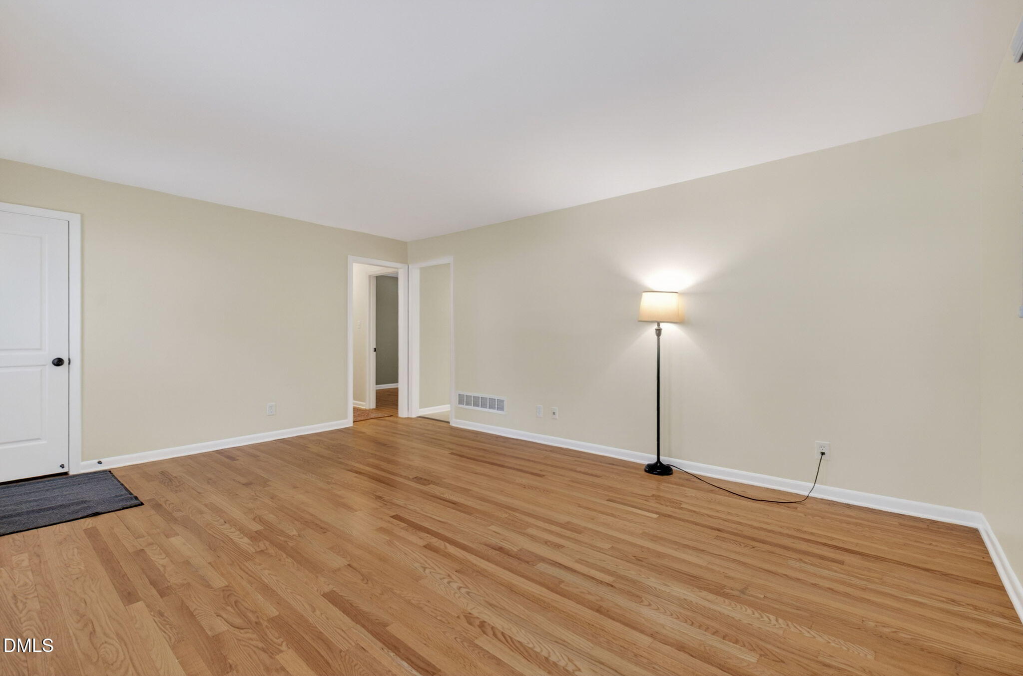 1224 Pineview Drive Raleigh, NC 27606 - Photo 7 of 45 a view of empty room with wooden floor