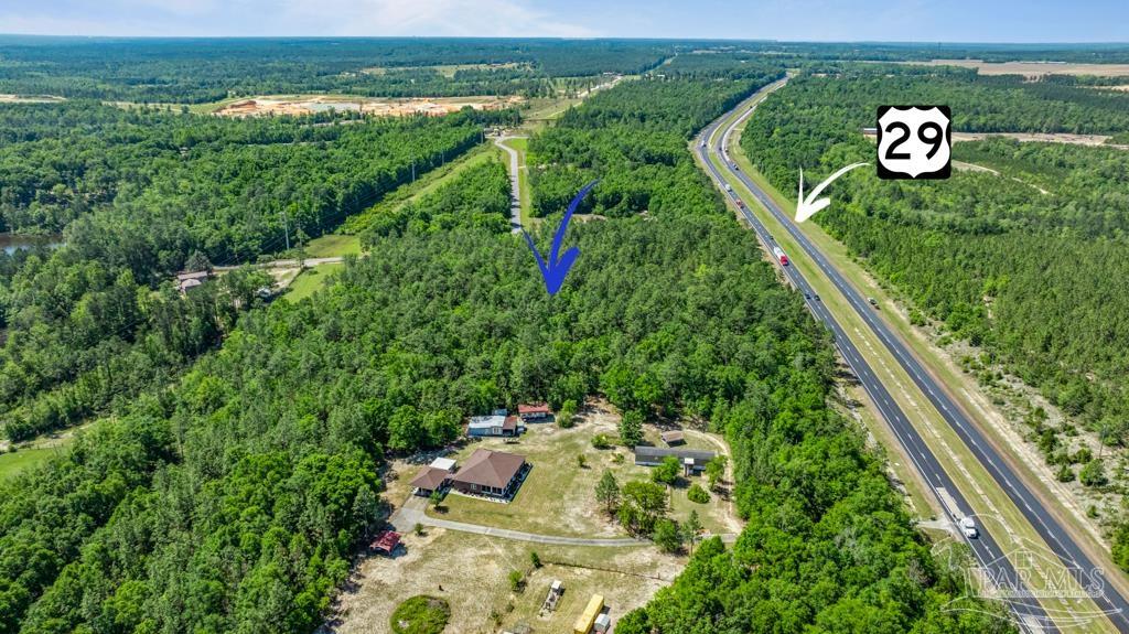 1400 Lake Heights Road Molino, FL 32577 - Photo 5 of 18 an aerial view of a house with a yard and lake view
