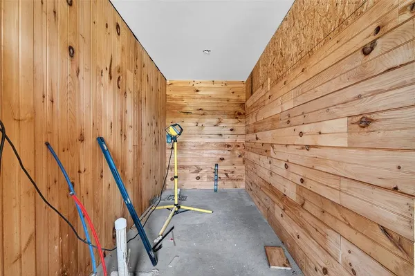 a view of walk in closet with clothes