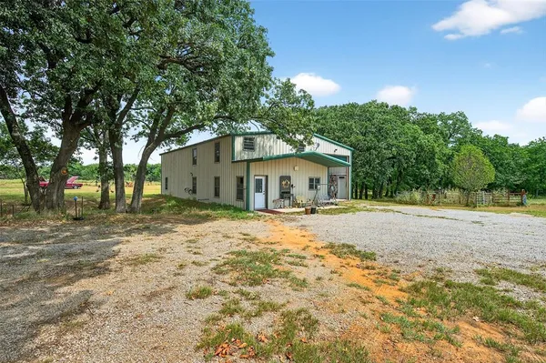 a house with trees in the background