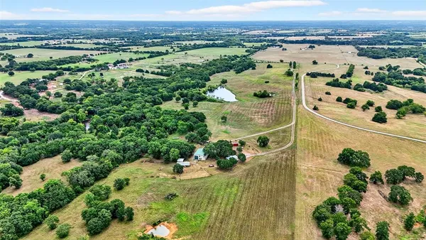an aerial view of a houses with a outdoor space