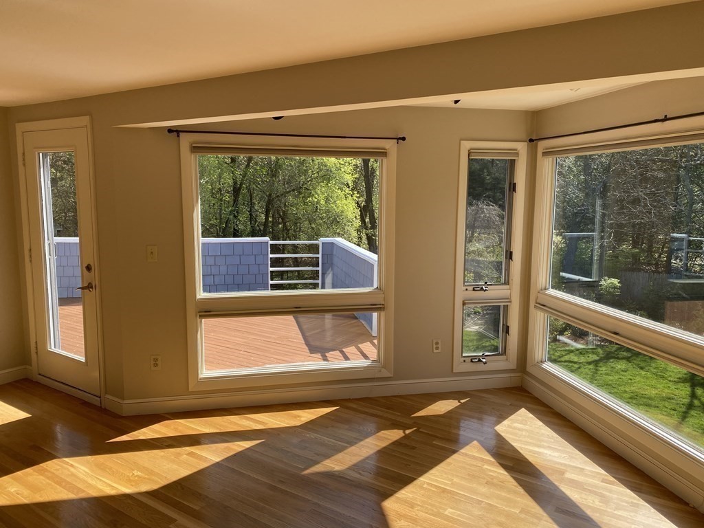 490 Concord Road Sudbury, MA 01776 - Photo 13 of 31 a view of an empty room with wooden floor and a window
