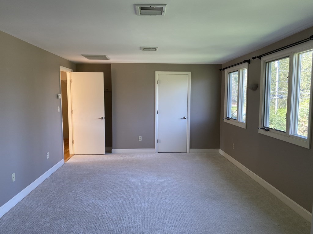 490 Concord Road Sudbury, MA 01776 - Photo 15 of 31 a view of an empty room with a window