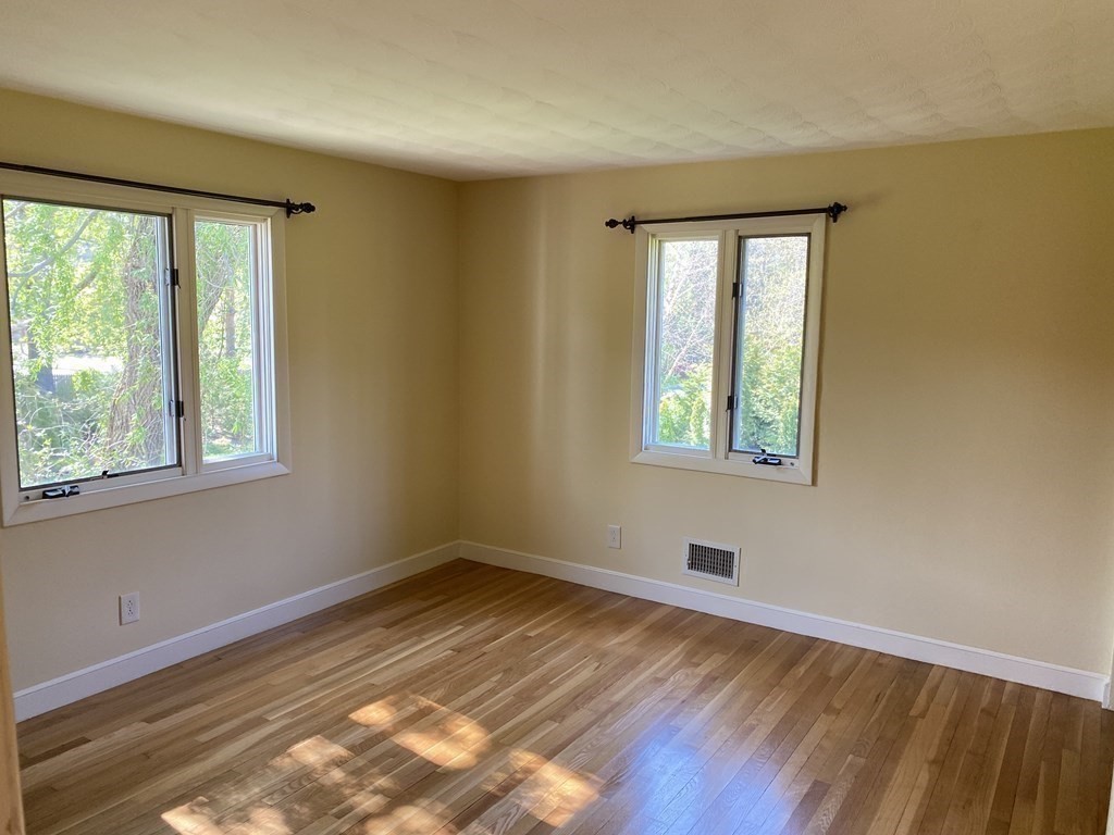 490 Concord Road Sudbury, MA 01776 - Photo 19 of 31 a view of empty room with wooden floor and fan