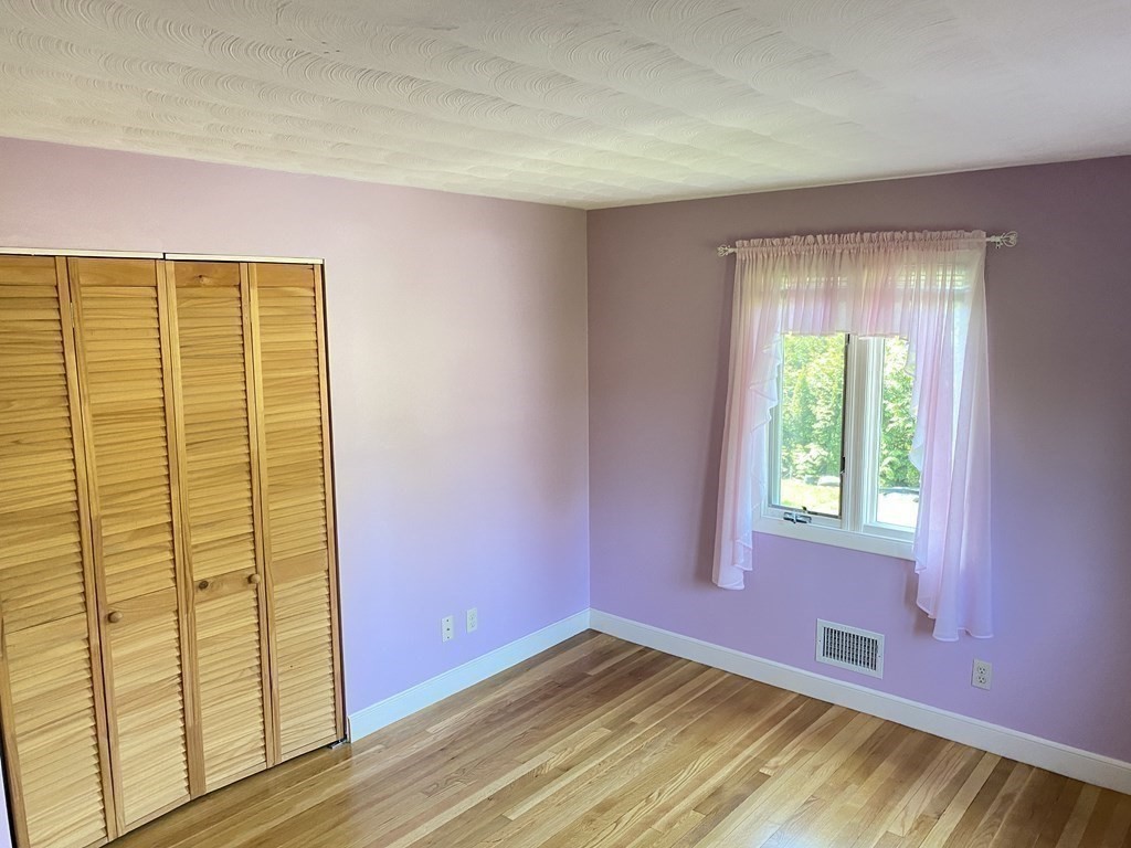 490 Concord Road Sudbury, MA 01776 - Photo 20 of 31 a view of an empty room with a window