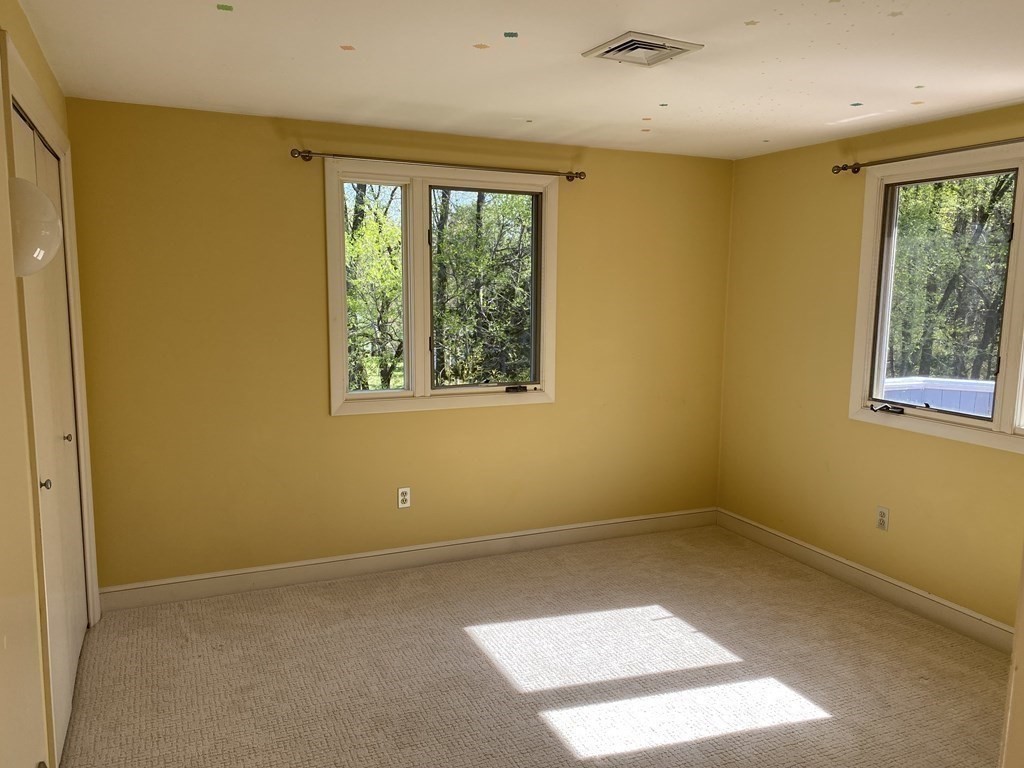 490 Concord Road Sudbury, MA 01776 - Photo 21 of 31 a view of an empty room with a window