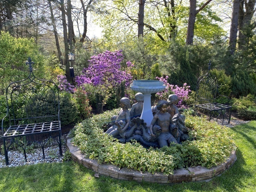 490 Concord Road Sudbury, MA 01776 - Photo 25 of 31 a sign that is sitting in the middle of garden