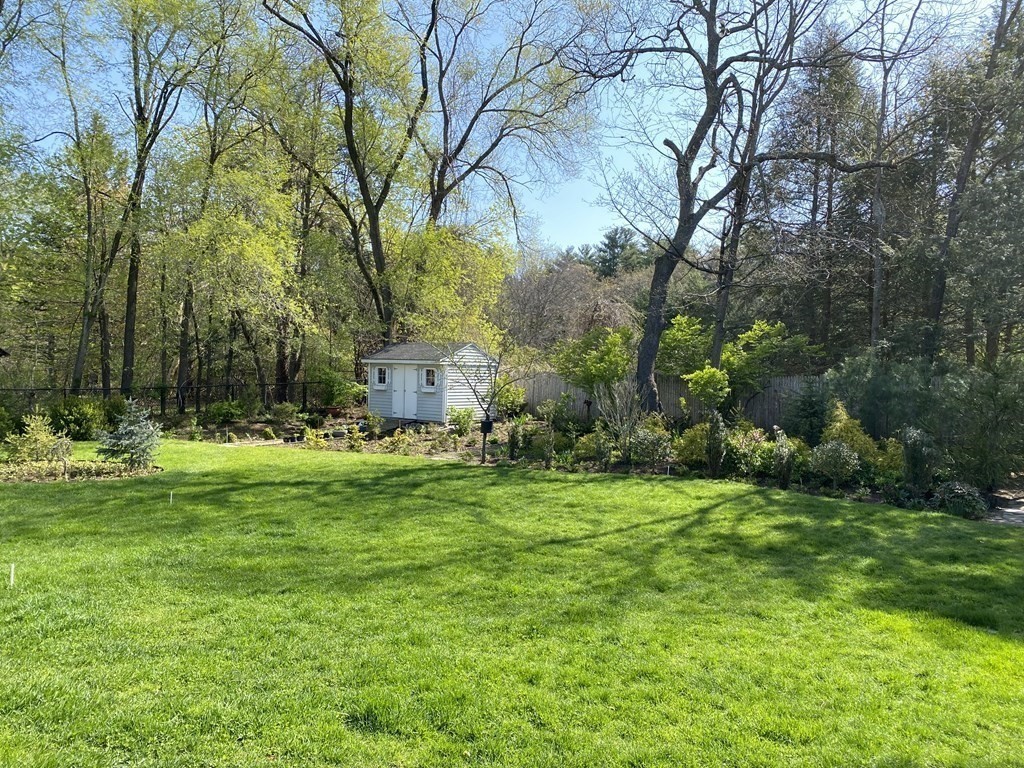 490 Concord Road Sudbury, MA 01776 - Photo 28 of 31 a backyard of a house with lots of green space