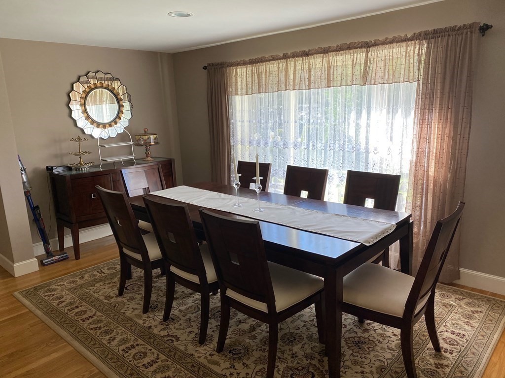 490 Concord Road Sudbury, MA 01776 - Photo 7 of 31 a view of a dining room with a table and chairs
