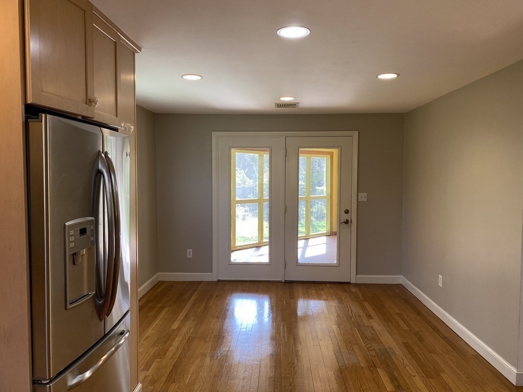 490 Concord Road Sudbury, MA 01776 - Photo 10 of 31 a view of empty room with wooden floor and fan