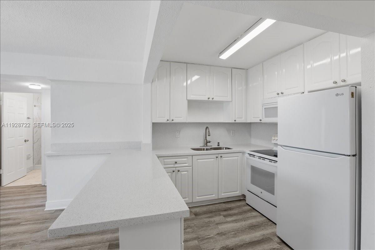 Hialeah Hialeah, FL 33016 - Photo 13 of 32 a white refrigerator freezer sitting inside of a kitchen