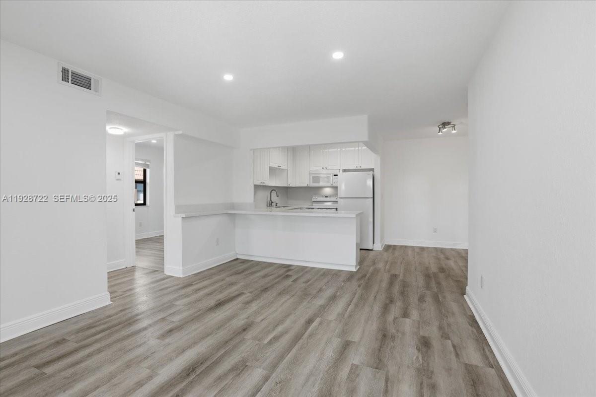 Hialeah Hialeah, FL 33016 - Photo 10 of 32 a view of a kitchen with wooden floor